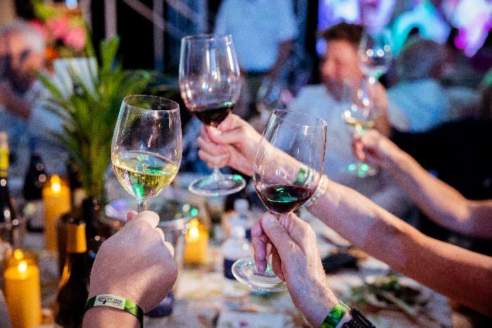 Destin Charity Wine glasses raised
